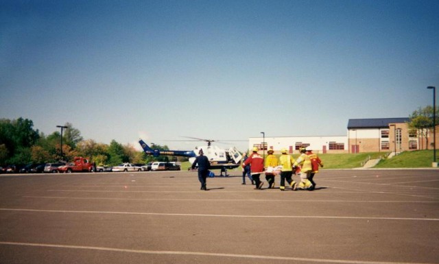 Carrying the victim to Skycare, AGHS Mock Crash in 1998